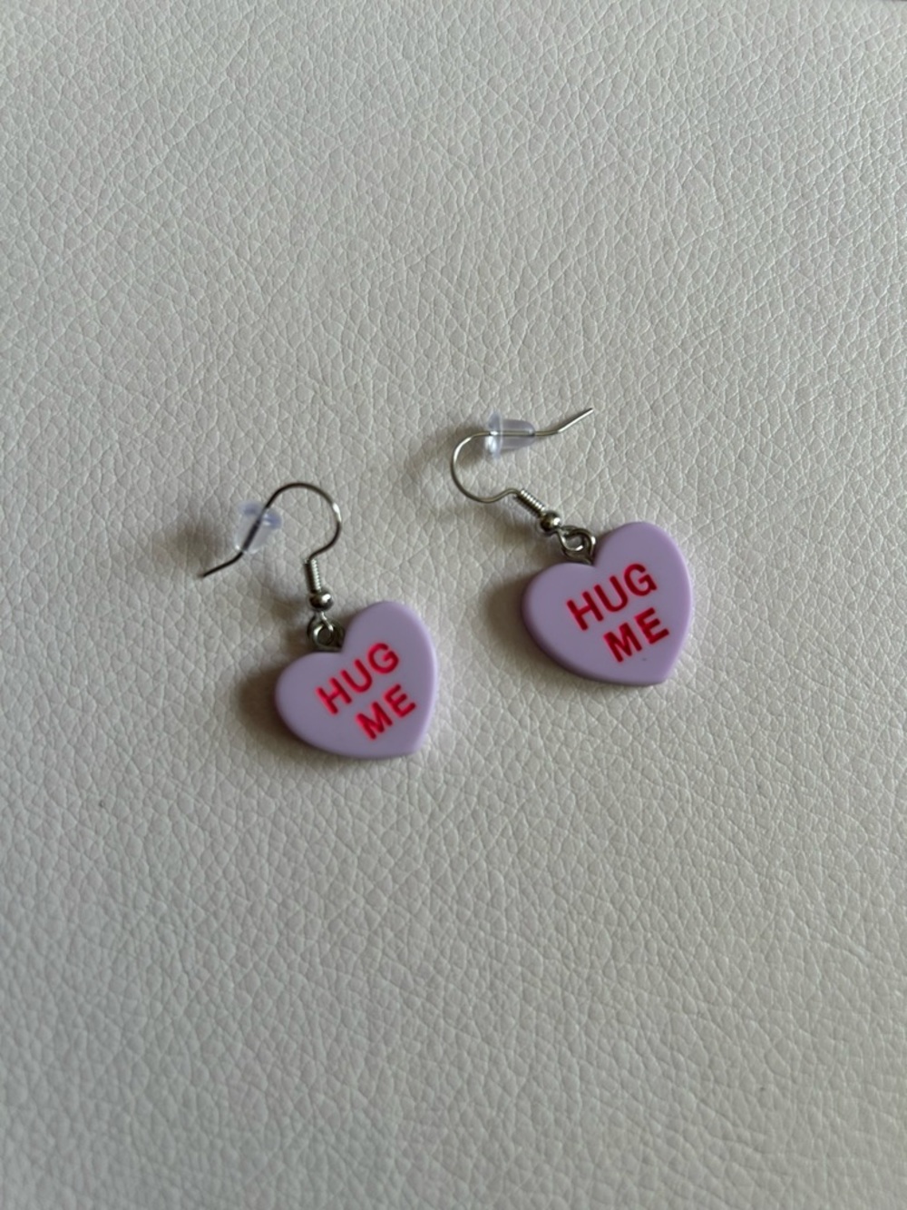 Conversation Hearts Hug Me Drop Dangle Earrings in Purple with Pink Lettering